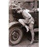 Lady Mends A Car