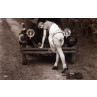 Lady Mends A Car